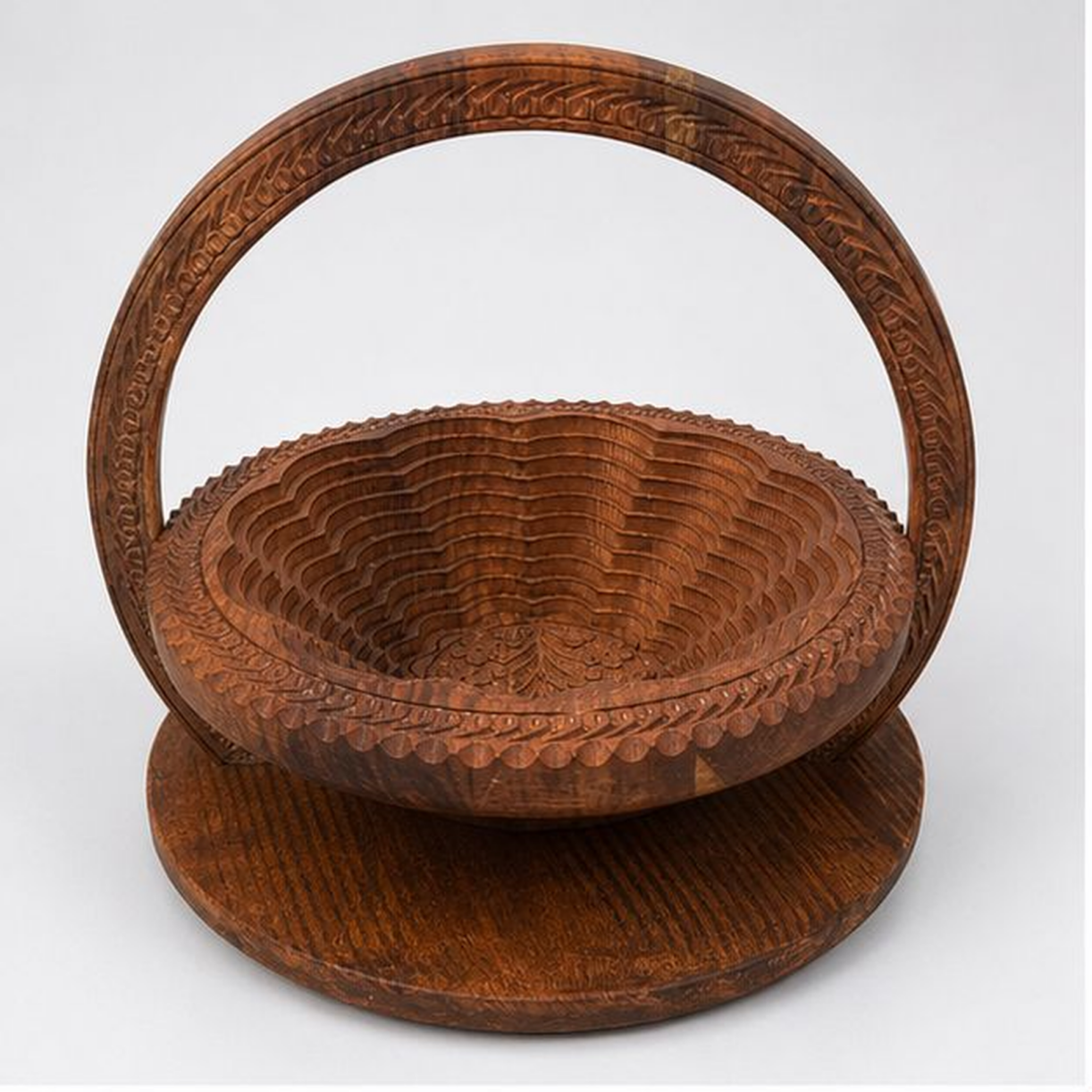 Handcrafted carved wooden expandable fruit basket